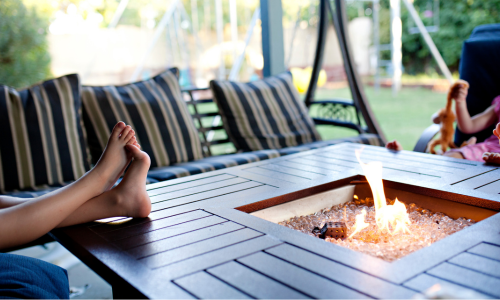 Feet on outdoor fireplace