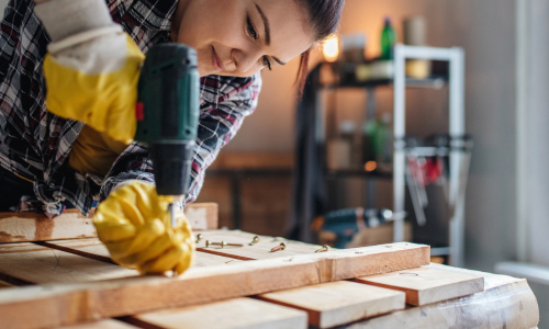 Woman using power drill